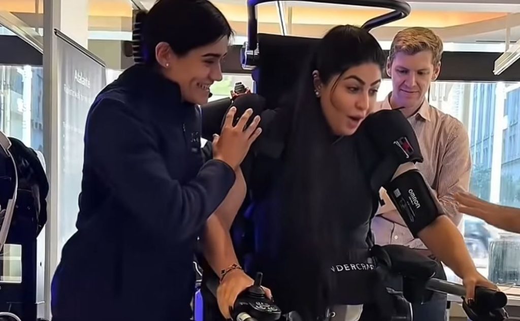 Paralysed woman stands for first time with robotic exoskeleton